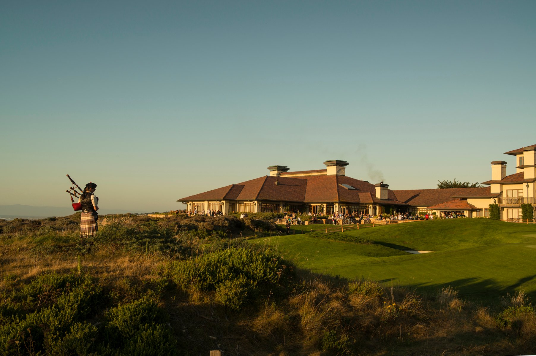 The Inn at Spanish Bay — bagpiper at sunset on the green